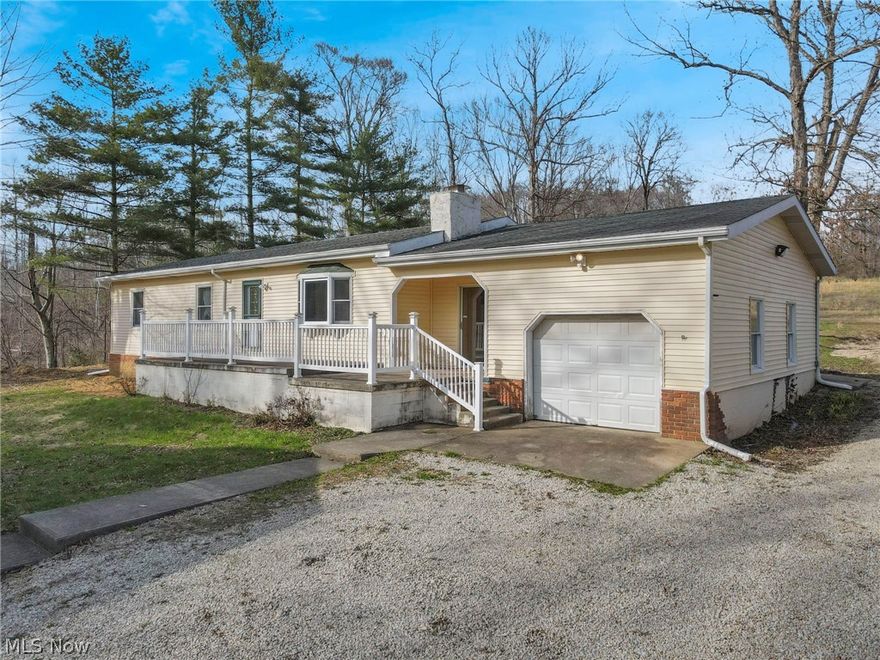 Looking to enjoy Burr Oak this summer?  This 3 bedroom, 2 bath ranch style home is right down the road. It is nestled on a private lot with beautiful views and a pond. The family room addition is perfect for taking in the natural surroundings and wildlife with all of the windows and natural light. The addition has hardwood floors, a wood burning stove, a full bath and laundry. The eat in kitchen has solid surface counter tops and plenty of workspace. The lower level is ready to finish and has plenty of storage space. Newer HVAC system. Attached 1 car garage and 4 car carport perfect for cars, boats, etc. Lot split is being completed and acreage should be approx. 6.436 acres.