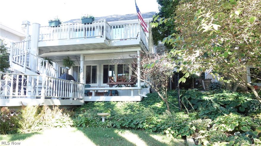 Waterfront wonderful and superbly located on the "main chain" of Portage Lakes....*Bonus* walking distance to Turkeyfoot Golf Course! 3 season room on the lakeside of house w/ large mulit-level decking (beautiful spiral staircase from upper deck to lower deck), plus an additional lakefront deck and dock!  1st level bedroom has double sliders to the upper deck that overlooks the Portage Lakes!  On the 1st floor: Hardwood floors under carpet & a wood burning fireplace!  2 car garage w/a patio & paved parking!  Rich décor throughout & beautifully cared for! Many updates: Windows, doors, furnace, roof, window treatments, hot water tank,  garage door, washer/dryer, more!  Call Beverly for a private showing to make this your "Portage Lakes Lakefront Home"!