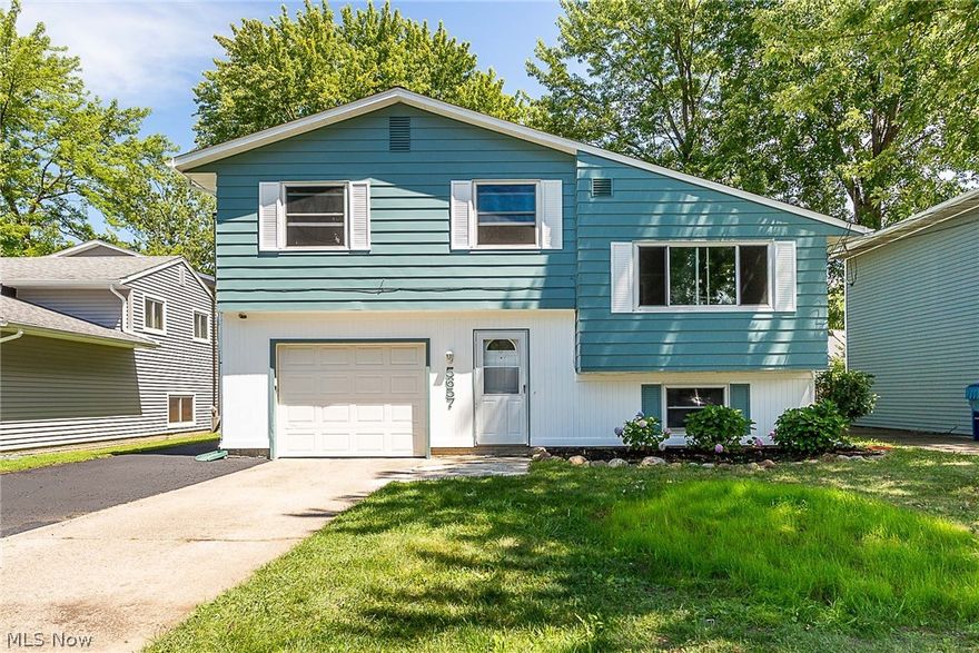 Welcome Home! This quad-level come is newly renovated and and ready for new homeowner. When you enter the home you are welcomed by a spacious foyer with a coat nook with bench, a full bathroom, and access to the one car garage, which has a bonus room that is perfect for an office or crafting room. The lower level of the house has a spacious family room, that could be used as a fourth bedroom. The lower level also has a separate utility and laundry room. The second floor features an open concept living room and eat-in kitchen, with recent updates including a beautiful tile backsplash, custom countertops, and a new sink and faucet. The third level has three spacious bedrooms, and well as a second full bathroom. All three bedrooms have wood floors that have been stripped and refinished. The backyard is accessible through the bonus room, and has a new partial wood privacy fence, and has the electrical work already installed for a pool. The interior and exterior of the house have been fresh