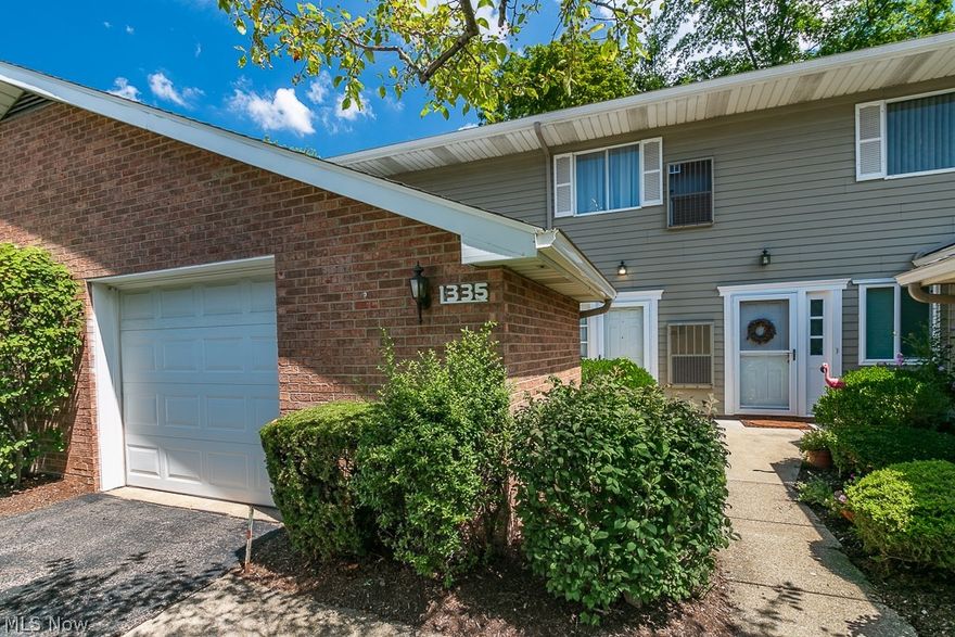 Beautiful walkway with new deluxe hybrid landscaping in 2021. This ranch condo is on the 2nd floor a deck overlooking the peaceful wooded setting. Upon entering you will notice the stunning open living room & dining room & sliders to the large private deck. Updated kitchen with eating area. Corian countertops & all appliances included. Full-sized laundry room & pantry storage includes the washer & dryer. Updated kitchen in 2020. New furnace and A/C in 2021.  New carpet and paint throughout 2020.  The master suite has a large bedroom, bathroom, and huge walk-in closet. 2nd Bedroom also has a full wall closet & there is a full bathroom in the hallway. Attached one-car garage & additional guest parking available for visitors throughout the complex. Association maintained tennis courts & common space. 10 minutes from the freeway, and 15 min to University Circle. A must see.