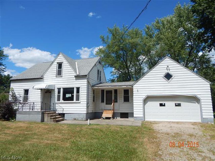 Country setting on almost an acre for this bungalow style home with attached 2-car garage, large family room, wood deck out the back, 2 bedrooms first floor and 2 on 2nd floor.  Total of 5 parcels.  Equal Housing Opportunity.  Sells As Is.