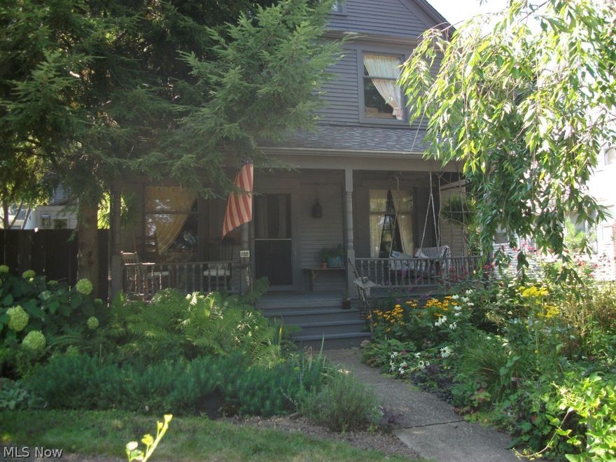 Built in 1902, this home has the distinction of being on Lot #1 of the Ariel Bradley Estate. In 1807, he founded the Village of Mogadore and as a young boy was a spy for George Washington. This Century Home has the look and feel of the early 1900's--comfortable, warm and inviting, but with all the modern conveniences of the 21st Century and has been featured in three magazines since 2012. This Colonial style home has 3 bedrooms, 3 full baths, 1,672 SQFT. of living area and features: a parlor; living room; freshly painted dining room; newly renovated kitchen with center island with base cupboards and a 6' counter, new stainless steal refrigerator and Samsung gas oven; original hardwood floors and double paned windows (except for 4 original front windows); central air; forced gas heat; a clean and dry basement; a freshly painted full attic; washer and dryer; etc... The outside of the home features a small cabin that can be used as a potting shed or children's playhouse, a storage shed, a