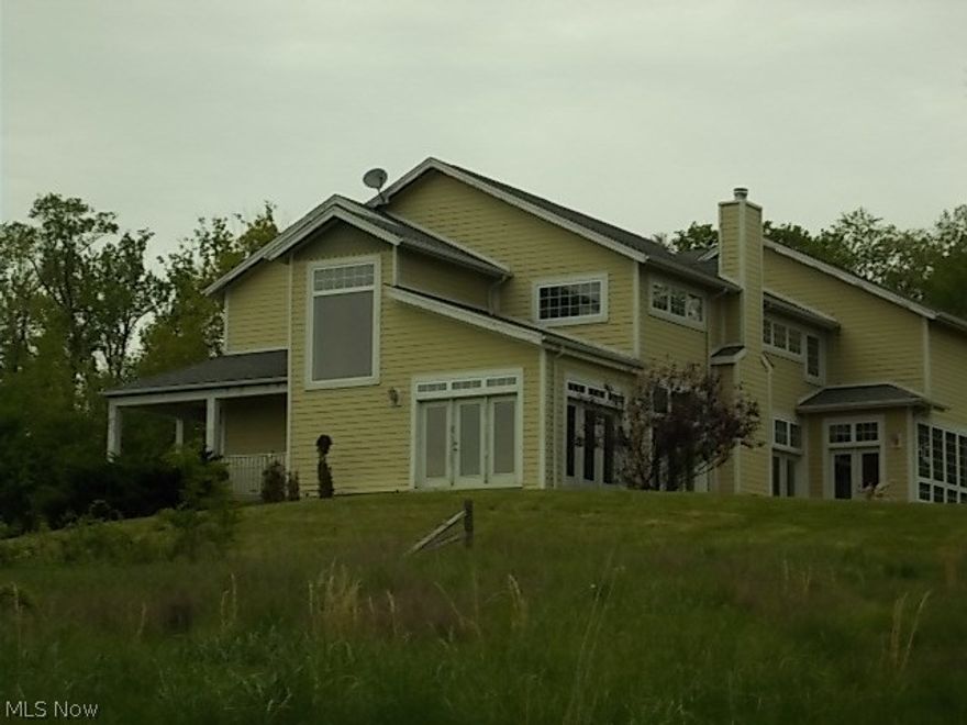 Lots of windows to enjoy the Fantastic Views of the wooded hillside on 2 5 acre parcels! Large gourmet kitchen with center island. Main floor features a Florida Room, Great Room with fireplace, Den and Dining room. The hallway separates the main floor living areas with 2 staircases and balcony overlooking Great Room! Upstairs has sitting/game room, 3 bedrooms and full bath. Plus, master suite with spectacular master bath.