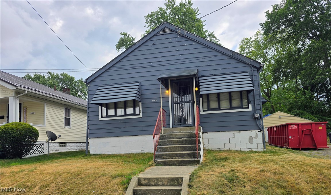 This is an investor's dream! This three-bedroom house features aluminum siding and original wood floors beneath the current flooring. It boasts a spacious kitchen, one full bathroom on the first floor, and a shower stall in the basement. The property sits on a double lot, making it an excellent opportunity for rehabilitation and renovation. The home has air conditioning and an awning-covered back area for outdoor seating, overlooking a small backyard. The garage needs a new roof. Submit all offers today!