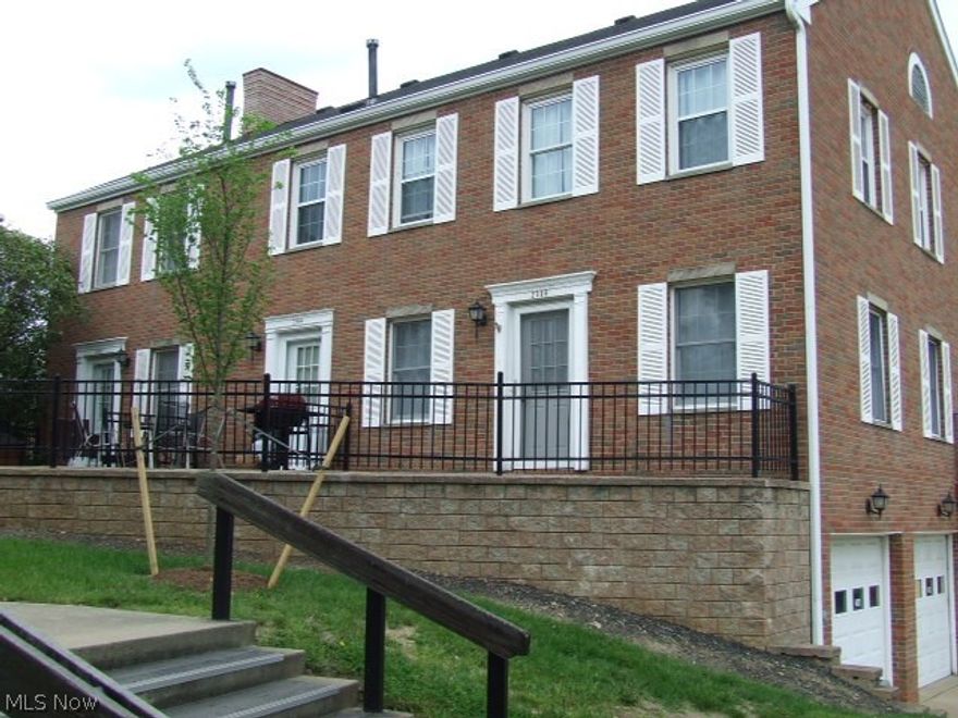 Brick 2 bed/1.5 bath condo in the Cuyahoga Falls-Front Street area close to riverfront, shops, restaurants and entertainment! Townhouse style with 1 car garage with auto opener, laundry/utility and additional storage space on lower level. Upstairs to the main living quarters is a large open living/dining area with newer carpet. Oak cabinetry in kitchen with breakfast bar and ceramic floor. Newer furnace, hot water tank, dishwasher and stove.  Master bedroom has French doors opening to a deck.  Full bath has soaking tub and new toilet. Additional half bath.  Paver patio overlooks the Riverfront area.  Extra quest parking available across the street from condo. Come and enjoy the el-fresco lifestyle of the riverfront!  Reserve a private showing today!