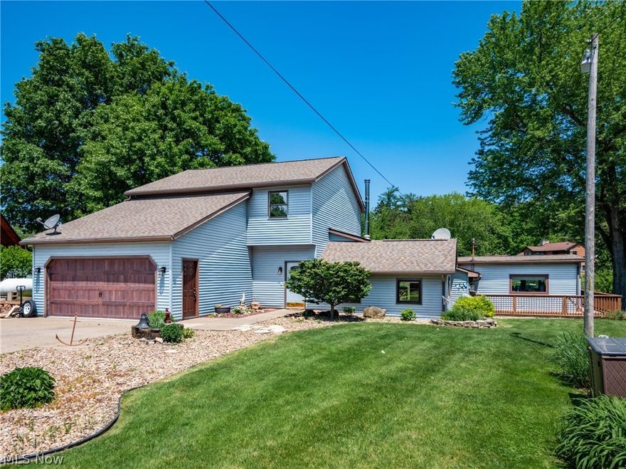 Great property on the lake, Open floor plan for entertaining,  2400 Sq. Ft. of living space, The family room that flows into the   kitchen that goes out to the private deck looking out to the water,  Master suite offer a private bath and a large walk-in closet, with 2  more bedrooms rooms and  another full bath,  half bath down ,large  laundry room down and more storage, 2 car garage, a storage buildings,, Annual MWCD lease rental $4600