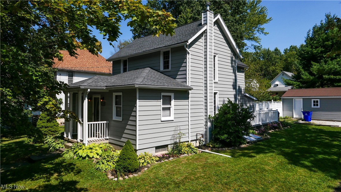This charming home, nestled in a beautiful and quiet neighborhood, sits on a desirable corner lot with a fenced-in back and side yard. The property boasts two high-quality Trex decks, perfect for outdoor relaxation and entertaining, along with a detached garage for added convenience. Inside, the home has been thoughtfully updated throughout. The second floor features a newly added half bathroom and fresh carpeting, including the staircase. The first floor includes a laundry area with appliances, a spacious, airy living room, and a formal dining room where natural light enhances the beautiful hardwood floor. A versatile room on the first floor can serve as either a bedroom or a home office, providing flexible living arrangements. The kitchen is the true centerpiece of this home, featuring sleek granite countertops, a matching undermount sink, and modern appliances. Beautiful Kraftmaid cabinets provide both style and functionality, while herringbone tile flooring and crown molding lend a touch of elegance. A practical mudroom, adjacent to the kitchen, offers ample storage space and direct access to the fenced yard. With an updated first-floor bathroom and modern features throughout, this home seamlessly combines comfort, style, and practicality, making it an ideal retreat in a peaceful, scenic neighborhood.