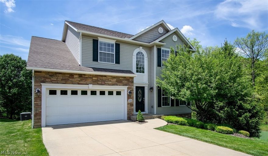 Open and spacious colonial in Heron Crest. This beautiful home with stone accent on the front elevation is waiting for you! This center hall colonial offers a first-floor office with hardwood flooring, French doors and windows that overlook a pond making this a great office for those working from home. To the rear of the home is a great room complete with a corner gas fireplace, hardwood flooring and patio doors leading to the 2-tier rear deck that offers a nice view of the backyard. Off the great room is the kitchen (open to the great room) with hardwood flooring, stainless steel appliances and lots of cabinets. Completing the 1st floor is a laundry room and half bath. From the foyer you will see the staircase with a handrail made of wrought iron and wood that leads to the bedrooms on the 2nd floor as well as a balcony area. The owner’s suite has a walk-in closet and a private full bath with dual sink vanity, garden tub and a separate shower. There are 3 remaining bedrooms and a full