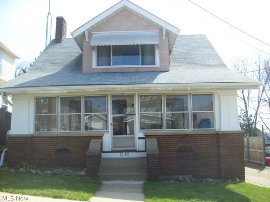 Move in and enjoy all the "pluses" here! The inviting living room features beautiful woodwork, hardwood floors and fireplace. The adjacent dining room has hardwood floors and built-in window seat. An open kitchen with eating area leads to the back deck for additional outside dining enjoyment. This home offers three bedrooms and one bath on the second floor. An additional half bath in basement awaits your finishing touches. The enclosed three season front porch in the front of the home offers additional relaxation space!  If that's not enough, there is a large tiered deck overlooking the fenced backyard, and 2+car garage. Many updates in recent years include house and garage roof, bathroom, new water line to street, hot water tank. Close to elementary school. SPRING today and enjoy your next summer here!