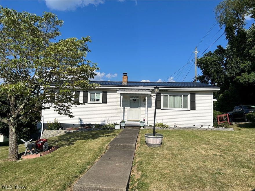 Cozy 3 bedroom ranch. Per owner: metal roof is 2 years old, newer vinyl windows and storm doors,hot water tank replaced in 2019.This home features a covered front porch, a rear deck,and a  side porch leading into kitchen.Owner states that there are hardwood floors in all bedrooms .