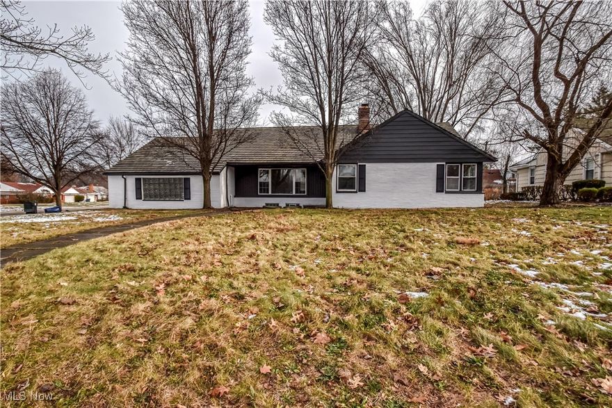 This super spacious three-bedroom ranch has been tastefully restored. Recently refinished hardwood floors run through most of the home. A large living room with a wood-burning fireplace opens to the formal dining room, creating a great space for entertaining. All three bedrooms feature large closets, and the primary bedroom is generously sized. The bathrooms have been tastefully updated with all new fixtures, and the kitchen offers brand new cabinets, quartz countertops, and luxury vinyl flooring. A den with walls of windows is off the kitchen and is a great additional room. The basement has been refreshed with painted walls, ceiling, and floors, making it an ideal hangout or bonus space. Additional features include an attached oversized garage and a large lot. all located in the historic Forest Hills subdivision