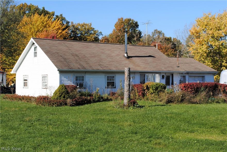Wonderful home on 7.28 acres offers peaceful setting for new owner.  Open floor plan compliments today's living.  Living room opens to spacious kitchen with island.  2 bedrooms and 1.5 baths on main floor.  1st floor laundry room.  Stairs lead to partially finish 2nd floor offering the possibility of 2 more bedrooms upstairs.  Patio.  Shed.  30 X 80 outbuilding with water is solar powered... 1st half is workshop with concrete floor and car lift... and 2nd half offers 2 horse stalls and loads of space.  Newer septic.  Great opportunity.  Call agent today.