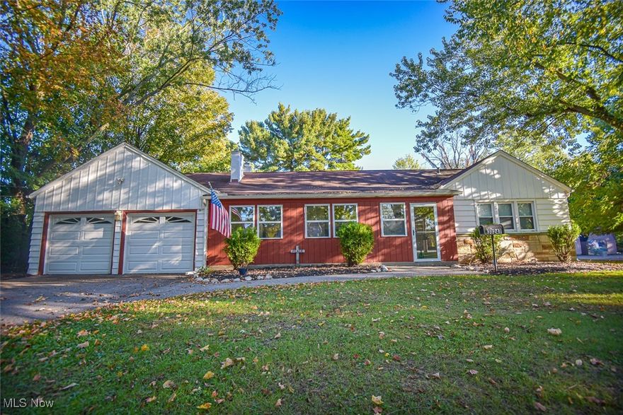 Nestled on 1.66 acres, this charming ranch home offers space, character, and endless potential. Step inside to find an enclosed front porch that welcomes you into a comfortable main level featuring three bedrooms, a spacious living room, a dining room, and a bright, cheerful kitchen. A huge walk-up attic invites your imagination with the possibility of being finished into a cozy retreat, home office, or additional living space. The finished basement extends your living area even further, offering two recreation rooms including one with a bar, a versatile bedroom option, a storage room, and a dedicated laundry area, all accented by classic glass block windows. Outside, the appeal continues with a long driveway leading to a two-car attached garage, a convenient sidewalk along the side of the garage, and beautifully maintained landscaping. The fully fenced backyard is perfect for relaxing, entertaining, or play, and the property itself extends well beyond the fence, providing even more room to enjoy. Currently used as a single-family residence under a nonconforming use allowance, the property is zoned General Retail Business, creating unique opportunities for its next owner.
