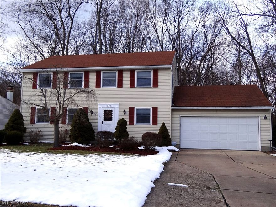 Beautiful view of woods and stream from the multi-level deck of this Colonial.  Family room has wood floor and a wood burning fireplace and walks out to the deck.  Formal dining and living room.  Large master bedroom has a generous walk in closet, and separated vanity and toilet/shower.  Good room sizes in other bedrooms.  Basement has been finished with an open space consisting of a huge living room and bar.  A great place to watch the big game.  Home is close to school and other amenities.  Call today to make an appointment!