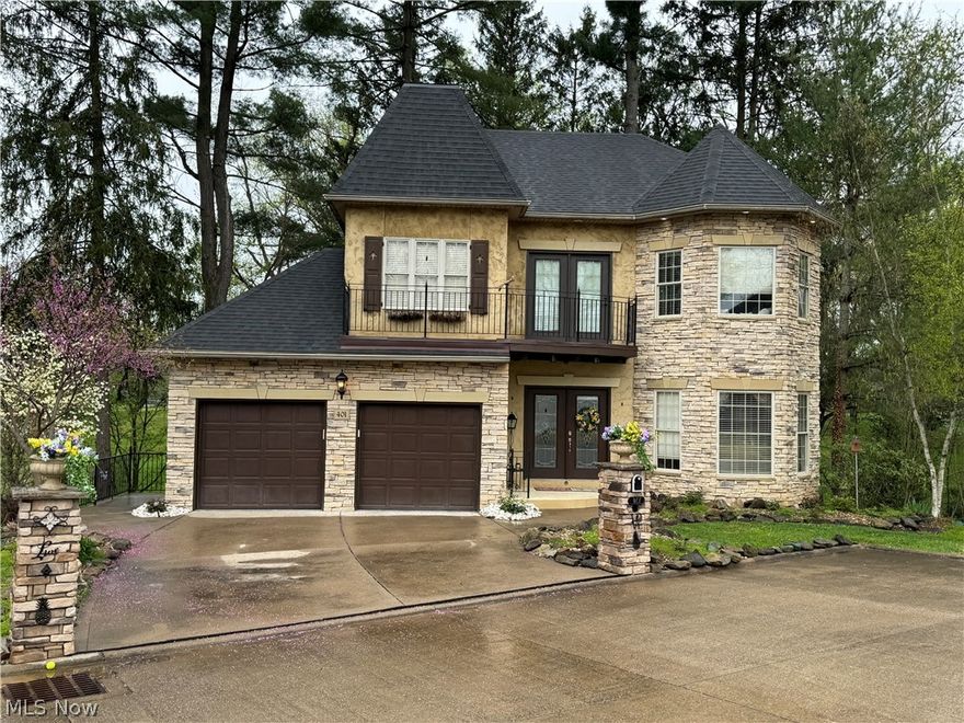 This exceptionally well-built Italian/Tuscan style home is located on a cul-de-sac with views of the golf course from the large back deck and the fenced in patio area with fire pit. Two stone columns mark the entrance to the driveway and the house is surrounded with a variety of trees and landscaping. Inside features include cherry floors, custom kitchen cabinets, granite counter tops, marble floors, gas fireplace, central vacuum, vanguard mana bloc water line system, and crown molding throughout the main level. New roof and balcony on 3/8/2024.