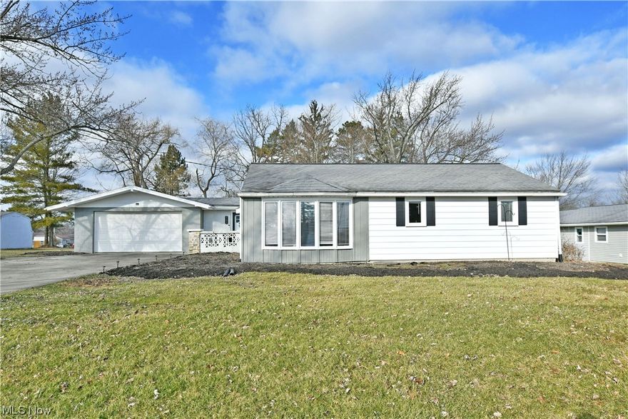 With its charm-packed interior and beautiful upgrades throughout, this lovely Streetsboro home makes an easy choice to start your next adventure! Offering up curb appeal in spades, the attractive grey and white exterior is quick to catch your eye, noting the wrapping bay window that graces the front of the residence. Around the back, an impressive rear patio area includes a nearby firepit as the partially fenced yard yields plenty of privacy. Inside, a welcoming foyer sets the tone with its thoughtful design elements and hardwood styled flooring that continues through the floorplan. Meanwhile, the central dining room opens to reveal tall ceilings with exposed truss work as the sliding glass doors introduce plenty of natural light. A guest bedroom awaits around the corner, taking full advantage of its own backyard entry for a mix of sunlight and scenic views. Enjoy the updated kitchen with its stone countertops and cherry-colored cabinets that glisten beneath the recessed overhead lighting. Relax in the illustrious nearby living room with its handsome brick accent wall, adding to the appeal. Down the hall, a lovely full bath showcases a tiled shower surround and elegant vanity. The two remaining bedrooms complete the package to include the oversized master with dual closets. Call today for more!