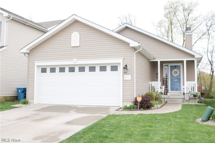 Here is your chance for tax abatment living in Amherst schools, with this 3 bedroom, 2 bath ranch located in the Vineyards at Martin's Run. This 9 year old home has been updated with modern conviences for comftorable living. The fully fenced in yard, encloses a deck with a hot tub right off the back sliding glass door. The open floor plan is fantastic for entertaining, watching over the kids, or making sure the fur babies are behaving, as the fireplace in the family room can be seen from the kitchen, letting all the natural light flow. 2 bedrooms, a master suite, and a laundry room complete this one floor living. The backyard overlooks a wooded lot that backs up to a pond, that offers seclusion while enjoying the backyard amenities. The partial basement has been finished with plush carpeting and recessed lighting for some extra living space. The basement also features a massive crawl space for those annual decorations. Call today and find out how you can afford fine neighborhood living