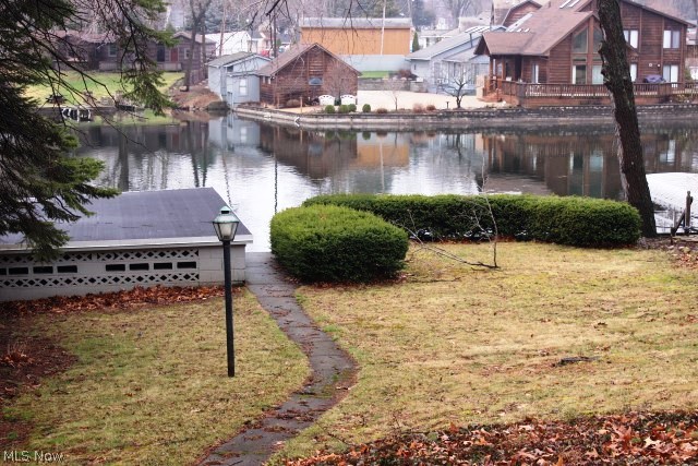 Small but mighty! Located on West Reservoir, main chain of lakes w/concrete sea wall, concrete block boat house, 2 car detached garage & so many updates & extra nice* Updated kitchen w/range, microwave, & refrigerator* Family room w/wood burning stove & slider to newer enclosed sun room (approx. 3 yrs) wrapped with windows- all with view of lake* Master bedroom with walk in closet* Updates include shingles (approx. 2011); leaf guard (2013); central air & electrical panel (2009); boat house tuck pointed (2009)* Move in condition* Immediate possession just in time for spring*