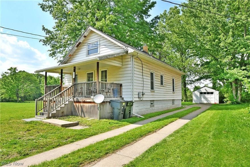 Find a surprising amount of living space in this potential packed, four-bedroom Warren home! Set on a scenic lot with tall trees casting plenty of natural shade, the residence waits with its covered front patio to welcome you inside. A split cement driveway runs alongside to find a detached single car garage. Meanwhile, a powered chair lift offers easy mobility access to the raised rear porch. Inside, a carpeted living room is first through the door, inviting with its open layout. A guest bedroom branches away nearby with wood panel wall treatment. The central dining room enjoys large windows and plenty of sunshine that spills across the hardwood styled flooring. Nearby, the ample kitchen brings warm wood cabinets and stainless trimmed appliances. Completing the floor, a second bedroom awaits near a short hall leading to a full bath with a low entry shower. Upstairs, a pair of additional bedrooms each flank a central common area set just off the landing. Call today for more!