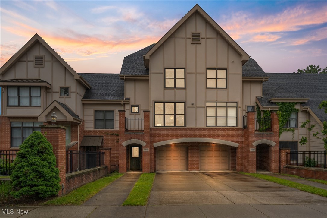 This delightful Townhome in the Shaker Heights School District is Move-In Ready and sure to impress! Built in 2006, it boasts a bright, modern design across Three Levels. On the lower level is the attached 1-Car Garage, while the Main Entrance on the First Floor opens to a spacious Bonus Room ideal for a Recreation area, Gym or Home Office. Take note of the Extra Parking behind the Condo which has a Secondary Entrance and provides ample spaces for guests or for a second vehicle. You'll find an Open-Concept layout on the Second Floor with Stunningly Large Windows filled with natural light that highlight the pristine Hardwood Floors. The Living Area includes an Electric Fireplace with Wooden Mantel and Built-In display shelves, creating a stylish focal point that seamlessly connects to the Dining Area and Dramatic Chandelier. A Breakfast Bar links the dining space to the Well-Appointed Kitchen, which includes wrap-around cabinetry, Granite Countertops, Ample Storage, and access to a Front-Facing Balcony. Upstairs on the Third Floor, you'll find two generously-sized Bedrooms, each with their own En-Suite Bathroom and Walk-In Closet. A convenient Laundry Area is also located on this level. Situated just minutes from the Heart of Historic Shaker Square offering the accessibility to Shaker Square Shops, Restaurants, a Movie Theater and Dave's Supermarket. Minutes from Case Western Reserve University, Cleveland Clinic and University Hospitals' Main Campuses, Severance Hall and the renowned Museum District. This beautiful home offers the perfect blend of Comfort, Style, and Location—ready for you to move in and make your own!