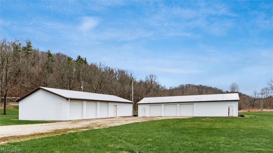 Discover the versatility and convenience of this level 3.69-acre property, ideally located just five minutes from interstate access. Fully cleared and ready for development, this exceptional parcel offers endless possibilities—perfect for residential, business, or recreational use. The property includes two well-equipped garages, both with separate utility meters. A 30x72 garage features three bay doors, electric, and water, while the 30x60 garage comes complete with electric, water, and septic—making it a great candidate for conversion into a barndominium or adaptable live/workspace. Utilities are already in place, including county water, well water, septic, and natural gas, providing a major advantage in time and cost savings for future projects. With its level terrain, flexible layout, and full utility access, this property is a rare find—offering the perfect setting to build your dream home, launch a business, or create your own private retreat.