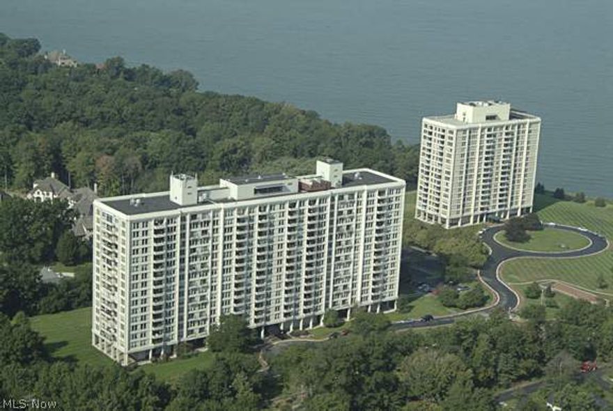 This is the prime suite in this complex. Finished to a high degree of excellence. Wonderful panoramic Lake and City views. Master wing has his/her separate contemporary baths in marble, stone, ceramic detailing. King-sized Master bedroom includes whimsical French balcony. Both balconies are finished in Nature Stone. Dine outside on 40ft balcony while watching boats pass by and for ease, pass-through window to kitchen for convenient entertaining. The bar area has the necessary equipment for entertaining guests. Sun fills the suite from east, west and north exposures. Quality throughout. Recreation room works perfectly as a music room and easily holds grand piano. The living room fireplace is set-up for using an electric insert. Beautiful carved, decorative moldings at chair rail and ceiling levels. Move-in ready. One of a kind