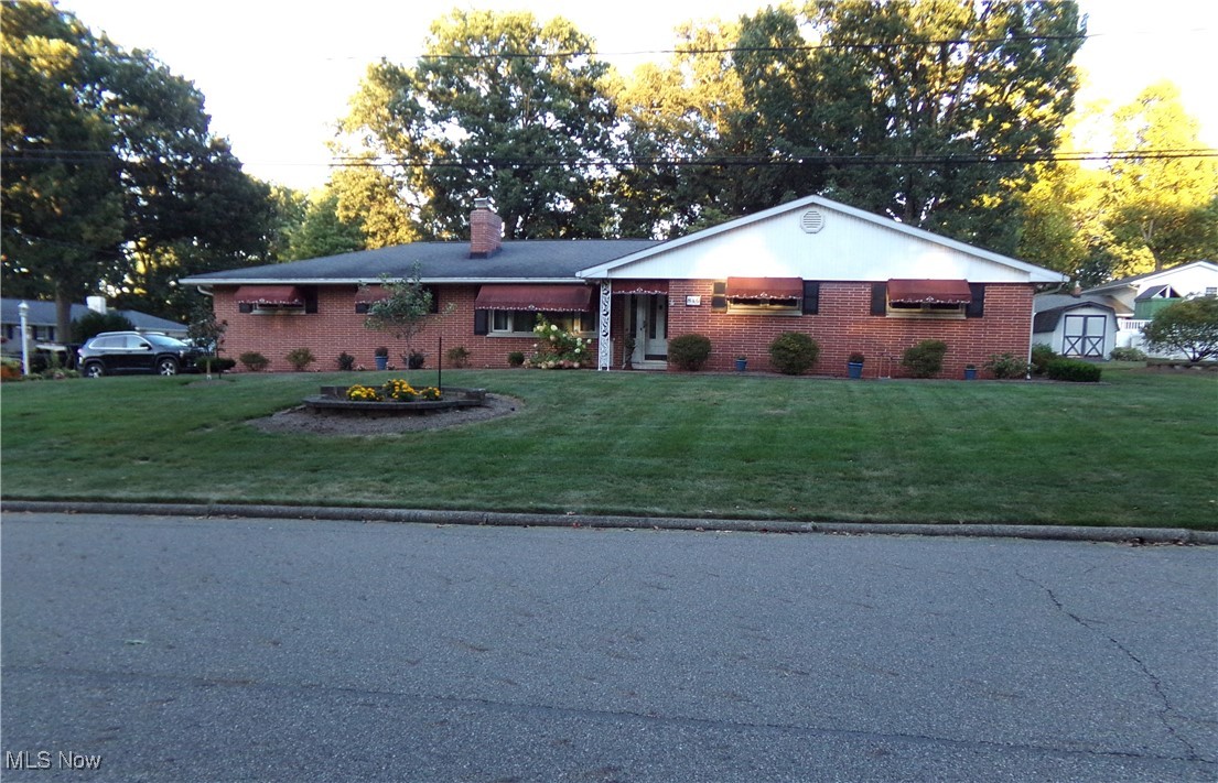Welcome to this beautifully maintained brick Ranch, wonderfully located in a sought-after Stark County neighborhood. This well-preserved, 3 Bedroom, 3 full bath home has a floor plan that offers spacious living as well as plenty of storage space throughout! All 3 bedrooms are very nice-sized, and the master includes a full ensuite. If you like to entertain, this home has LOTS to offer! The dining room extends out to a large 4-season room that then opens up to the back patio, providing you with a great setting for family gatherings at holidays or special events, PLUS... the lower level has a massive open floor plan that includes a family room, recreation room and bar area with another full bath. Situated on a corner lot, this home is one of the beauties of the neighborhood! Other amenities include: a 2-car, heated garage with ceramic block walls and an interior storage room, outdoor shed, lawn sprinkler system, invisible dog fence, the comfort of having a climate control hot water steam heat, upgraded to include central A/C.
New flooring is to be installed in the upstairs hallway, dining room, basement steps, lower landing and lower-level bathroom the week of 8/25.