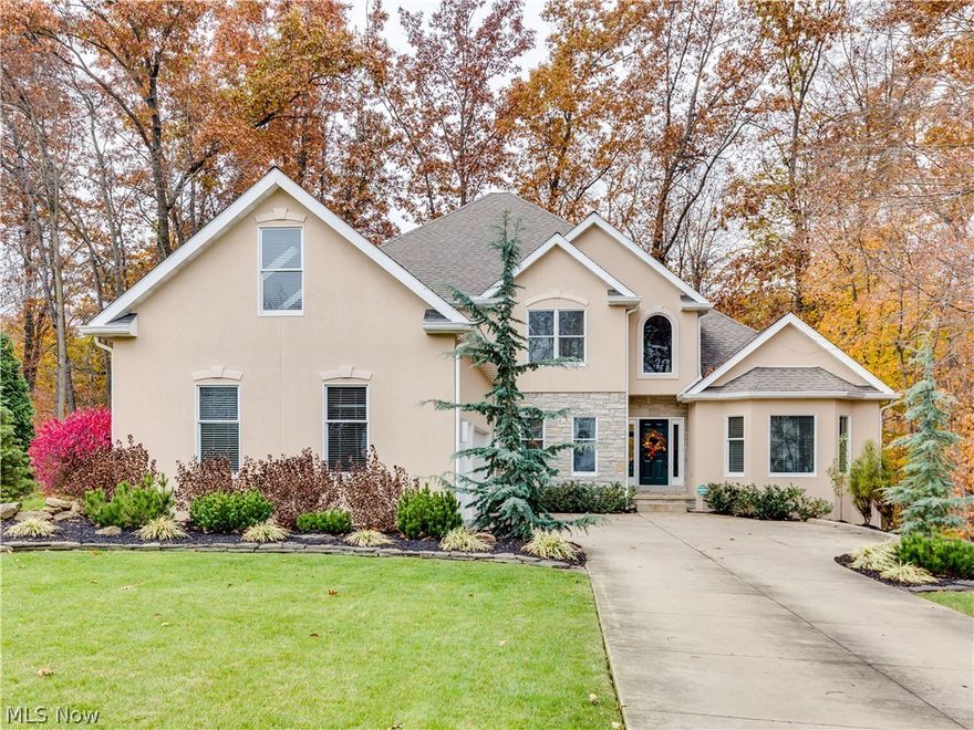 This lovely Northampton home is located on a beautiful wooded (1.17 acre) lot overlooking a gorgeous ravine and creek.  Enter the front door into the two story foyer. The Great Room has a floor to ceiling stacked stone gas fireplace and wall of windows overlooking wooded views. The kitchen offers stainless steel appliances,  double ovens, large pantry, granite counters, large island with seating & storage, and tile back splash. The adjacent eating area has sliding doors to the bright sun room. There is a first floor laundry with cabinets and wash sink. The first floor master has elegant tray ceiling, en suite master bath with Jacuzzi, double sinks and shower and two large walk-in closets. The second floor offers 3 bedrooms (1 bedroom with its own private bath and walk-in closet), two full baths, loft/sitting area, and walk-in attic area perfect for storage. The lower level is waiting for your finishing touch! The exterior was painted and the deck was restained in September 2017. Other