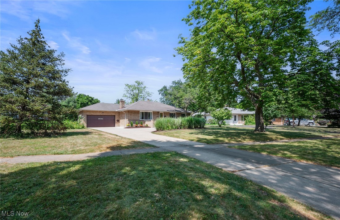 Fully renovated, spacious Mid-Century ranch in Cleveland's sought after Edgewater Park neighborhood. Generous room sizes throughout, including a large living room with a woodburning fireplace, and a larger rec-room downstairs with its own fireplace. Beautifully remodeled eat-in kitchen with stone counters, all new appliances, plenty of storage - and a view of your own park-like backyard. Well renovated bathrooms with elegant tile and marble. Replacement windows throughout. A central exhaust fan, right in the center of the house, works incredibly well at keeping the house cool with just fresh air. And the air conditioning makes for a very comfortable summer. Really lovely, refinished oak floors that look brand new. Every room in the house freshly painted. There's a really inviting screen porch off the dining room, with plenty of room for comfortable furniture and a table and chairs. It overlooks the backyard and opens onto the patio. Mature landscaping surrounds the yard and the entire house, with plantings and artfully installed pavers. The back yard is fully fenced and very private. The location could not be more ideal. A mature tree canopy makes this one of the most picturesque sections of Lake Avenue. And the house has enough set-back to make it a very quiet setting. There's a wide driveway with a turnaround that's ideal for guest parking. Everything is close by. Walk a half-block to the grocery store. Or walk to breakfast or lunch, or dinner and drinks. Drive less than 10 minutes and be right downtown, or in Hingetown or Ohio City. Or drive only 5 minutes to Gordon Square! Excellent access to all freeways. And Lakewood is at the end of the block. Edgewater Park is a really delightful 20-minute walk away. Open Sunday, 12:30-3:00.