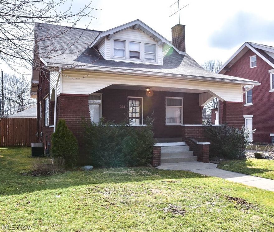 Tons of potential in this all-brick 2 bedroom colonial with a fenced-in backyard in Harter Heights! Great curb appeal with a 27x9 covered front porch. Step into the massive living room with a brick fireplace. French doors lead to the sun-filled dining room with hardwood flooring and walls of windows. The kitchen comes fully applianced! It has a deep pantry and a breakfast nook. Upstairs, the master bedroom offers a tandem dressing room with 2 closets. There’s an additional bedroom with a walk-in closet. The full bath is roomy and has built-in storage. More storage in the full basement! 2-car detached garage, too. Relax outside in your super private, fully fenced yard with a patio. Situated on a charming brick road. This home is Sold As-Is. Schedule a private showing today!