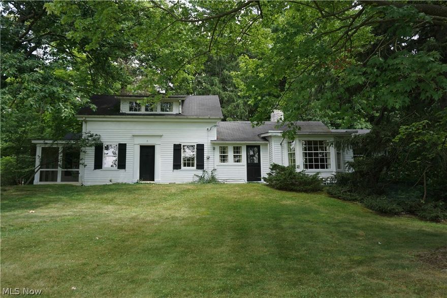 Historical Gates Mills gem on serene +/- 3.6 acre lot loaded with mature greenery. Built in 1837 yet this home contains many of the features desired today: spacious kitchen, large dining room, large living room with fireplace and a warm library. This home has a 1st floor master bedroom with private bath & screened in porch. Four bedrooms total (two on first floor) and three full baths. New hot water tank and water-proofed basement walls. Newer septic system and city water. Now ready for the next generation to become the steward of this fine home. Come experience what could be your slice of heaven.