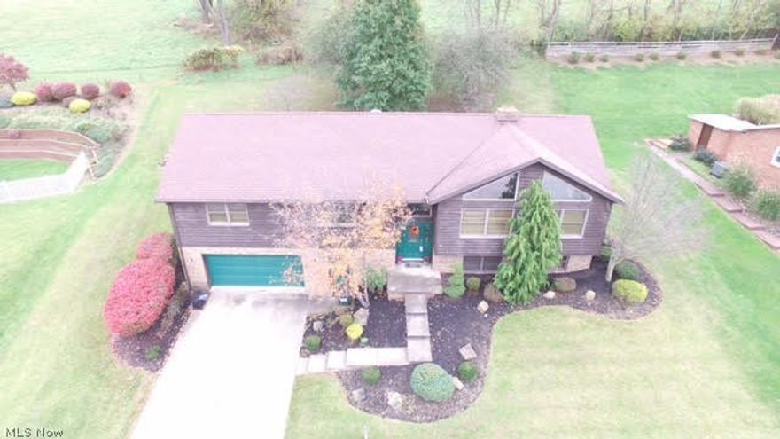 See this one soon it is Move-In Ready!! A beautiful brick raised ranch with 4 bedrooms, 3 full baths, 2 wood burning fireplaces, and a plus being in a desirable neighborhood of St. Clairsville close to everything!  Large windows and brick fireplace when you enter the livingroom. A formal dining room, large eat in kitchen with hand planked wood flooring, walks out to a private patio where you can eat and entertain. Master suite and 2 additional bedrooms on main level with additional guest bath.  Lower level has a wonderful large recreation room with fireplace and built in display/book shelves. Also in the lower level you have a bedroom and full bath, large work/storage area and laundry room. A dream garage with large work space/storage space/gardeners area, you decide!  Newer furnace, air conditioner, landscaping, retaining wall, carpet and appliances.  Home Warranty