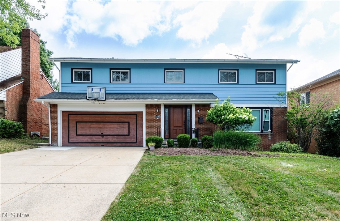 Amazingly Spacious Colonial home on prime street in University Heights. Oversized living room with laminate floors, and expansive windows paired with custom drapes and recessed lighting. Dining room in classic "L" shape with Living room also has laminate flooring and features a Chrystal chandelier. Family Room with brick hearthed fireplace includes a vaulted ceiling with exposed wooden beams, hardwood flooring and a perfect view of the backyard through a large picture window. The newly renovated eat-in Kitchen with granite countertops and Maple cupboards and drawers includes a wall of storage, as well as a newer double oven. Convenient first floor Laundry/mud room and half bath. The second floor, with newer carpet on stairs and in hall, offers four ample Bedrooms and two full baths and is headlined by the large Master bedroom with easy to care for laminate floor, connecting to a classic Jack and Jill bathroom with dual sinks and newer wallpaper. The second full bath also has dual sinks, and newer mold-resistant coating on shower. The lower level offers two finished rooms with glass block windows, and a full bathroom. The park like backyard is surrounded by towering trees and an attractive partial fence along with play yard. Close to Cedar and Green Road Centers, and Fairmount Circle shopping and dining! Great Value - Don't Miss!