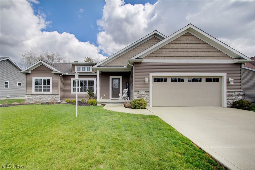 Built in 2019 by Rea Custom Homes, this beautifully designed ranch offers quality craftsmanship, thoughtful details, and over 2,800 square feet of finished living space on a spacious .34-acre lot in Pinecrest Meadows.

The main level features 1,842 square feet with 9-foot ceilings, rich wood flooring, elegant crown molding, and a built-in electric fireplace that creates a striking focal point in the open-concept living area. Large windows invite abundant natural light, enhancing the home’s warm and welcoming feel.

The kitchen is both stylish and functional, offering stainless steel appliances, tile backsplash, center island, breakfast bar seating, and ample cabinetry. The dining area opens to a patio overlooking the professionally landscaped backyard — ideal for entertaining or quiet evenings at home.

The split-bedroom layout provides privacy for the owner’s suite, complete with a spacious walk-in closet and a private bath featuring dual sinks and a walk-in shower. Two additional bedrooms and a full bath are thoughtfully positioned on the opposite side of the home.

A built-in drop zone off the 2-car garage leads to the main-floor laundry room with cabinetry and utility sink for added convenience.

The professionally finished lower level offers approximately 1,050 additional square feet with 8-foot ceilings, a large recreation space, full bathroom, and two finished bonus rooms. An egress window is located in one of the bonus rooms, offering flexible use for guests, home office, fitness, or hobby space. Ample built-in shelving provides excellent storage.

The property includes a DogGuard Invisible Fence system, adding peace of mind for pet owners.

Located in award-winning North Canton City Schools, this move-in-ready home offers custom construction, modern design, and flexible living space — without the timeline or added expense of building new.