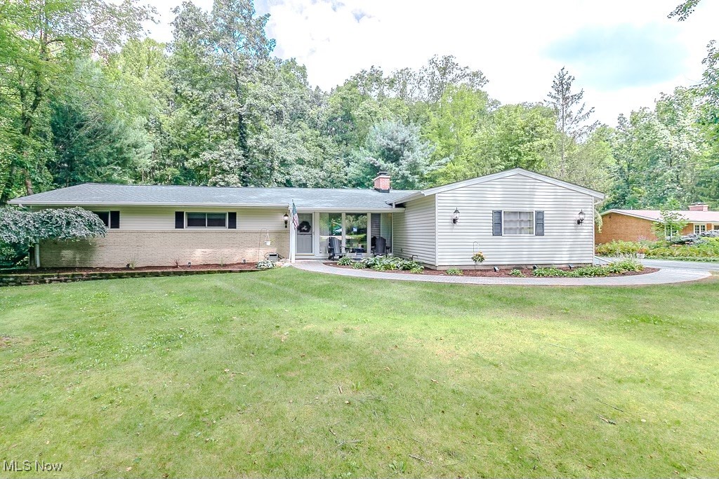 Welcome to 33 Woodside Road, a beautiful 3-bedroom, 2-bath home offering over 2,600 sq ft of living space. Nestled in a quiet, picturesque neighborhood just about a mile from downtown Chagrin Falls, this property sits on 1 acre with a peaceful, well-maintained yard—perfect for relaxing or entertaining. Inside, you’ll find two spacious living areas, an enclosed porch overlooking the backyard, and three generously sized bedrooms that provide comfort and flexibility. Recent updates include a new roof and gutters (2024), giving you peace of mind for years to come. Don’t miss your chance to own this inviting home in one of the area’s most desirable communities!