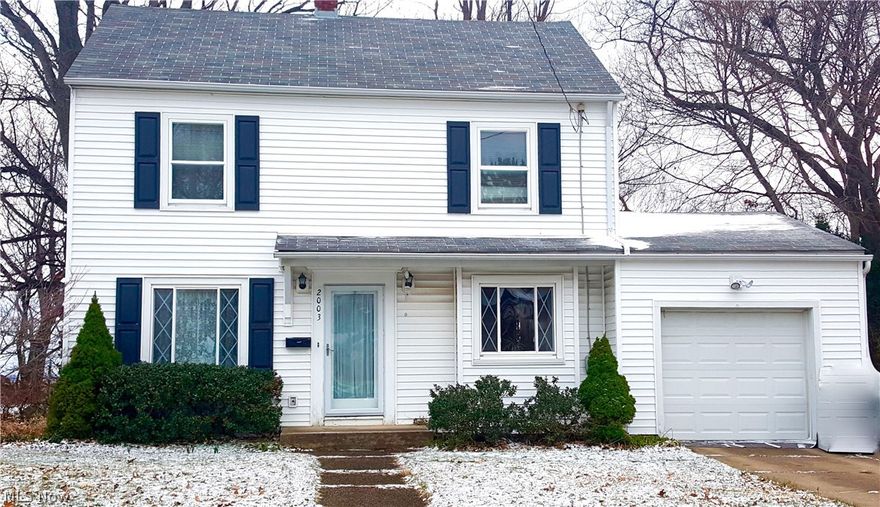 Great 2 story with newer roof and vinyl siding. Great view of Summit Lake and city of Akron. Wood floors throughout most of the first and 2nd floor. Lower level with rec room that is a walk out to concrete patio. Both bathrooms updated and have ceramic tile floors. Updated oak kitchen too.