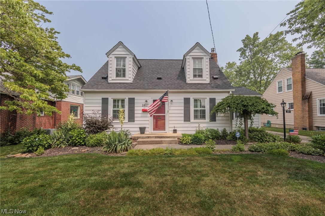A remarkable Cuyahoga Falls cape cod with a 26'x19' garage 2+ car garage! This immaculate home features an updated kitchen, and updated baths. The huge living room and dining rooms have natural hardwood floors. The quaint yard has a great garden, and patio area. There is a first-floor bedroom and full bath, as well as 2 ample sized bedrooms and the other full bath on the second floor. Do not miss a full basement, fireplace, custom blinds, and so much more.