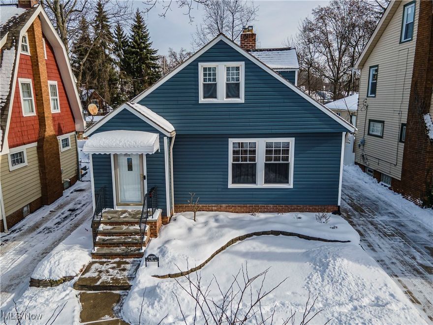 Impeccably updated and truly move-in ready, this charming home blends classic character with modern comfort. New vinyl siding in 2025. Other updates within the last few years include the bathrooms, kitchen, refinished original hardwood floors, replacement windows & roof, hot water tank and gazebo on the deck. The cozy living room showcases beautifully refinished original hardwood floors and a welcoming fireplace, creating an inviting space to relax or entertain. The formal dining area continues the timeless hardwood flooring, perfect for gatherings and special occasions. The kitchen features updated cabinetry, solid-surface countertops, a JennAir cooktop, and bright stainless-steel appliances, with a convenient breakfast bar enhancing both style and functionality. Sliding glass doors lead to a covered back deck, extending your living space outdoors. The spacious first-floor primary bedroom offers comfort and convenience, complete with a tastefully remodeled bathroom around the corner. A centrally located hallway provides ample linen and storage closets on the main level. Upstairs, you’ll find a versatile open area ideal for hobbies or a home office, along with an additional bedroom and half bath. The lower level includes approximately three-quarters finished recreational space—perfect for a media room, workout area, hobby space, or holiday entertaining—plus the added bonus of a full bathroom. This home is conveniently located minutes from John Carroll University, The Nature Center at Shaker Lakes, The Cleveland Museum of Arts, major hospitals, and much more.  Sellers are including a one year Home Warranty! Contact your  favorite realtor for a private showing.