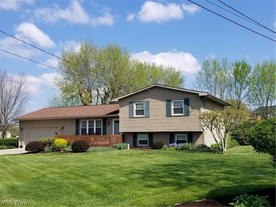 Outstanding 4 level split that is immaculate inside and out. Just move in and enjoy! Includes living room plus family room, kitchen plus dinette, 3 bedrooms with 2 full baths and a bonus room. Much hardwood flooring thru out. Updates include new dishwasher and water heater, range/oven and refrigerator, main bath remodeled, driveway and patio. The house was wired for Network data 5 years ago. The attached 2 car garage has vinyl VCT flooring. Don't miss this exceptional property!