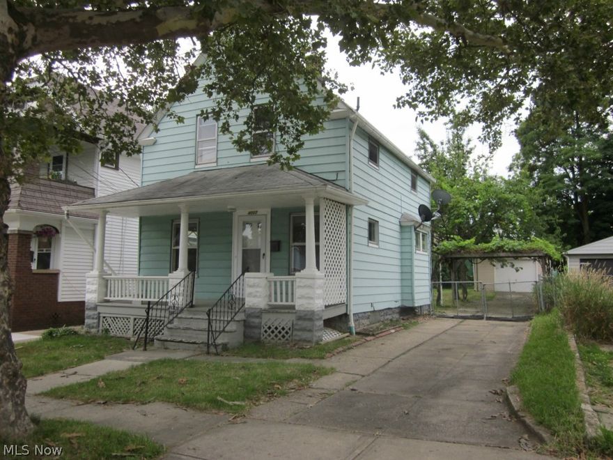 Affordable living in charming Old Brooklyn, this nice 3 bedroom, 2 full bath colonial just needs a little love to bring it back to its potential beauty.  This home features an inviting covered front porch, as well as a 2nd-floor rear balcony overlooking the treed, fenced back yard boasting a wonderful grapevine covered pergola patio area.  The appealing living room has a decorative fireplace as a focal point, and an adjacent formal dining room w/ built-in china cupboard.  The kitchen has ample cabinetry and counter space, and room for a café table and chairs. Upstairs, there's room for all in the 3 good-sized bedrooms, with large closets, and an updated full bath.  The full basement has a newer additional full bath, which has been recently added.  Handy to schools, shopping, highways and all conveniences, this home would be a great home to raise a family.  Priced to sell, no need to rent, with this more budget-friendly option!