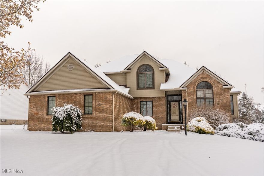 Welcome to this wonderful one-owner, beautifully maintained home in the highly sought-after Bayside Lake community in Stow, near the Hudson border. Built by Todd Wallace, this home is filled with quality craftsmanship, character, and an abundance of natural light thanks to its many windows and transoms throughout. The first-floor primary suite features high ceilings and great space, complemented by a dramatic two-story foyer and an impressive two-story great room with a gas fireplace. A private living/sitting room with a cathedral ceiling offers a quiet retreat, while the spacious formal dining room with crown molding and chair rail is ideal for gatherings. You’ll love the amazing sunroom/3-season room—designed with cathedral ceilings and walls of windows—that steps out to a private backyard with a deck, perfect for outdoor relaxing or entertaining. The large kitchen offers granite countertops, a walk-in pantry, center island, and convenient planning desk. A first-floor laundry with sink and cabinetry adds everyday convenience. Upstairs, you’ll find three generous bedrooms—two with walk-in closets and one with a cathedral ceiling—plus a large full bath with double vanity and a private tub/shower area. The 3-car garage with hot and cold water is a dream with its WoW Vinyl Floor coating and newer garage doors and openers (2022). Additional updates include Carrier furnace (12/2016), Carrier AC (2022), roof (7/2013), and granite counters (2012). The large full basement offers incredible potential for finishing. Located in a sidewalk-lined, well-lit neighborhood close to shopping, restaurants, and hike-and-bike trails, this home offers comfort, convenience, and timeless appeal.