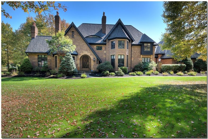 Elegant, Prominent & Old World Charm - 1 of a kind custom built dream home w/ 4 fireplaces is nestled on an amazing 5 acre property with pond, gazebo and greenhouse in the Ledges!  Absolutely stunning all brick & stone Tudor featuring character and quality like you have never seen!  This property boasts impeccable custom and detailed woodwork.  Imagine entering the grand foyer, admiring the staircase and the impressive coffered ceiling/wood paneled library w/fireplace.  The chef’s dream kitchen features beautiful cherry cabinetry, island with granite counters, built-ins & top of the line appliances.  The Butler’s pantry opens into the kitchen and dining room with French doors to 3 season sunroom to enjoy the gorgeous property.    The living room also features French doors to the sun room and boasts an amazing custom carved fireplace.  The redwood vaulted family room is remarkable with stained glass panels, which can be easily removed, stone fireplace and French doors to a lovely patio.