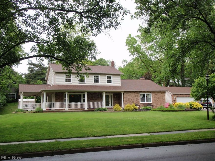 Updated colonial fit for a King. This home has shown much love to those who have entered through the leaded glass front door. No worry of places to sit for entertaining. It has a covered porch on the side of the house with fans,  a covered front porch plus a patio.  Red brick court yard with many perennials and grape vines with arbor.  Inside you will find 4 bedrooms, updated 2 1/2 baths (another full bath in finished basement).   Hardwood floors, newer windows, 
 5 yr old siding and roof.  Also newer furnace and central air conditioning(2yrs old)   3 car garage with cabinets for any car buff.   Like to cook? Then you will love this oversized kitchen with granite countertops and large island,plus walk in pantry.   Supersized family room with fireplace.  A wonderful place to call your home.