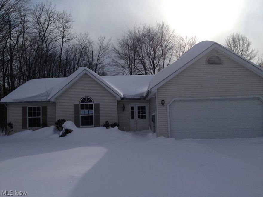 Great find in this 3 bedroom 2 full bath ranch in Roaming Shores!  Open floor plan, eat in kitchen with patio doors to rear deck.  Wood burning fireplace in living room, large master bedroom with full master bath.  Take a look today and make this house your home.