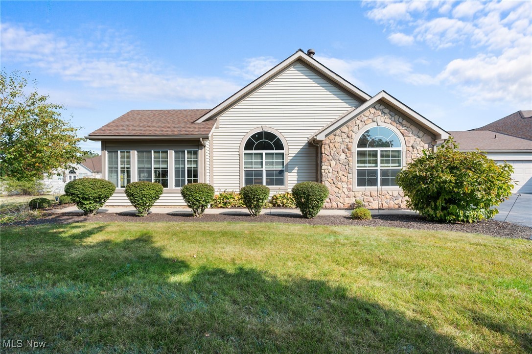 Welcome to this meticulously maintained 3-bedroom, 2-bath condominium in the sought-after Crossings at West Valley community in Brunswick, Ohio. The striking stone façade and covered entry invite you into a bright, open interior. Cathedral ceilings span the living room, dining area, four-season room, kitchen, and primary suite, creating a spacious, airy atmosphere. A cozy gas fireplace anchors the living space, while the sun-filled four-season room offers serene treed views and direct access to a private patio. The kitchen features a breakfast bar for two, a stylish tile backsplash, and new flooring, perfect for everyday living or entertaining. The primary suite includes a walk-in closet and a luxurious bathroom with a double vanity and a shower. An additional bedroom and full bath provide flexible space for guests, home office, or hobbies. Situated on a premium lot, the outdoor patio overlooks peaceful greenery. 2 car attached garage. Recent updates include a new roof, ensuring worry-free living. Enjoy access to the newly refreshed community clubhouse with a fitness center, library, heated pool, and outdoor barbecue patio, designed for convenience and relaxation. Don’t miss this exceptional condo—schedule your private showing today!