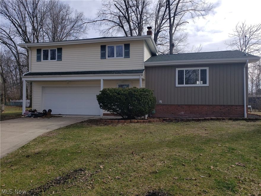 Freshly renovated, split level at the end of a quiet cul-de-sac. Three bedrooms and two full baths. Mid-level has a large open kitchen / livingroom plan with access to a large deck off the back of the house. Stainless steel appliances stay.  Good size yard. Three bedrooms and a full bath on the upper level. Entry level has the utility room and a full bath and direct access to the garage. 300 SF lower level could be finished into extra living space.