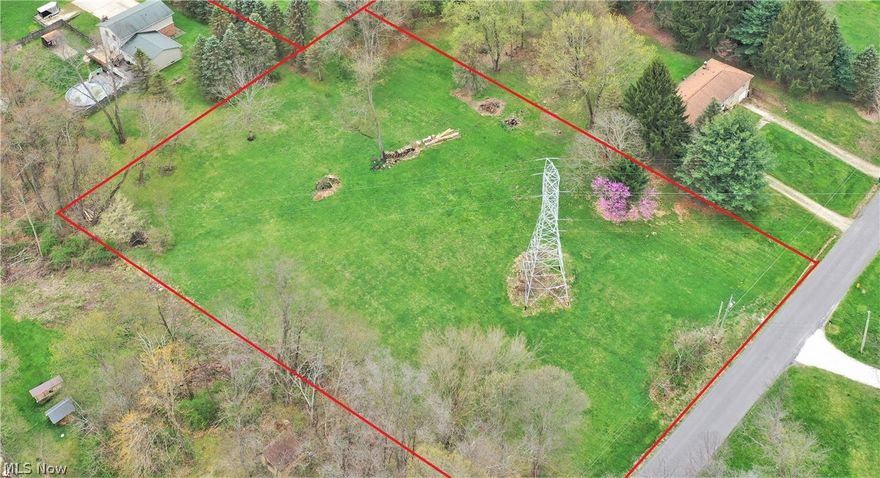 Level/rolling 1.65 acre lot with gas and electric available.  Neighborhood is well and septic.  Buyer and/or buyer's agent responsible for verifying building requirements, set-backs, well/septic, etc.  There is an Ohio Edison electric tower toward the front third of the lot.  Close to Mogadore Reservoir and boat dock, fishing, etc.  Feel free to walk the lot and/or call with questions.