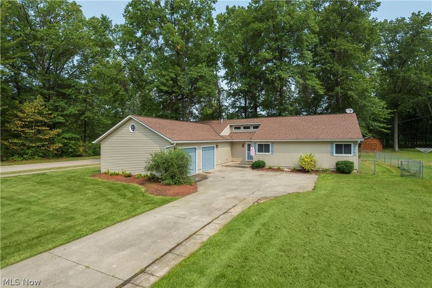 Welcome home to this completely updated Ranch minutes from Lake Erie. If you're seeking true one level living, look no further!!  The home features an Open floor plan with high ceilings, life lock luxury vinyl plank throughout with plush carpet in the bedrooms. The kitchen will awe any aspiring Chef with it's Stainless Steel appliances,  tile backsplash, granite countertops, island breakfast bar, soft close cabinets, farm sink & pantry...simply amazing! The laundry room is conveniently located down the hall toward the oversized 2 car garage. The dining room features a beautiful chandelier that will certainly be the focal point at every dinner party. Enjoy hosting football Sunday in your spacious living room. In the living quarters, you'll find two large bedrooms, a full bath, linen closet & the Master with walk in closet & ensuite full bath. The home offers ample storage & custom blinds throughout. You'll enjoy the serene, oversized, fully fenced backyard for get togethers or to let th