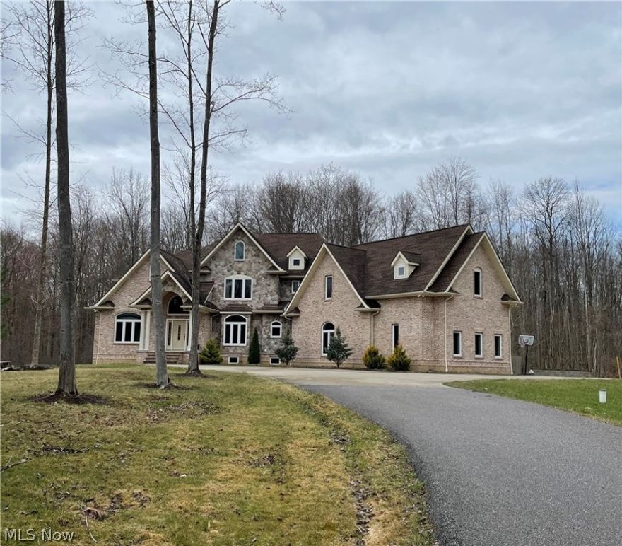 If you’re looking for a peaceful, secluded retreat, look no further! Nestled far off of the road approx. 800 feet back, on a private wooded 9.5-acre lot w/pond views, this light & bright colonial delivers privacy & natural scenery. Gorgeous stone & brick exterior & 3 car garage around the back. When you walk through the front door, you are greeted by a beautifully crafted wooden staircase, natural light & high ceilings. French doors allow for a peaceful & productive workplace in the office w/windows facing the pond. Wood floors & arched doorways flow throughout much of the living space w/spacious dining rm & living rm- plenty of rm for entertaining friends & family! Kitchen w/stainless steel appliances & lots of counter space. Two owner suites allow the option to choose- one on the 1st floor w/additional living space (currently used as a nursery) & another on the second level. The owner suites are in a separate wing of the home away from the rest of the bedrooms & living space, allowin
