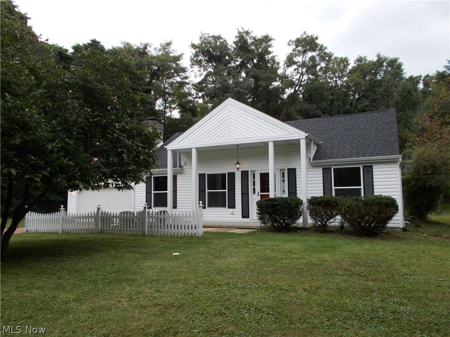 This is like a brand new home. 4 bedrooms, 2 full baths, basement, setting on a very nice scenic lot between 1/2 and 3/4 of an acre.  All new kitchen, flooring, paint, doors, bathrooms.  Like new inside and out. Loft overlooks huge living room.  There is a lot of room in fantastic colonial.